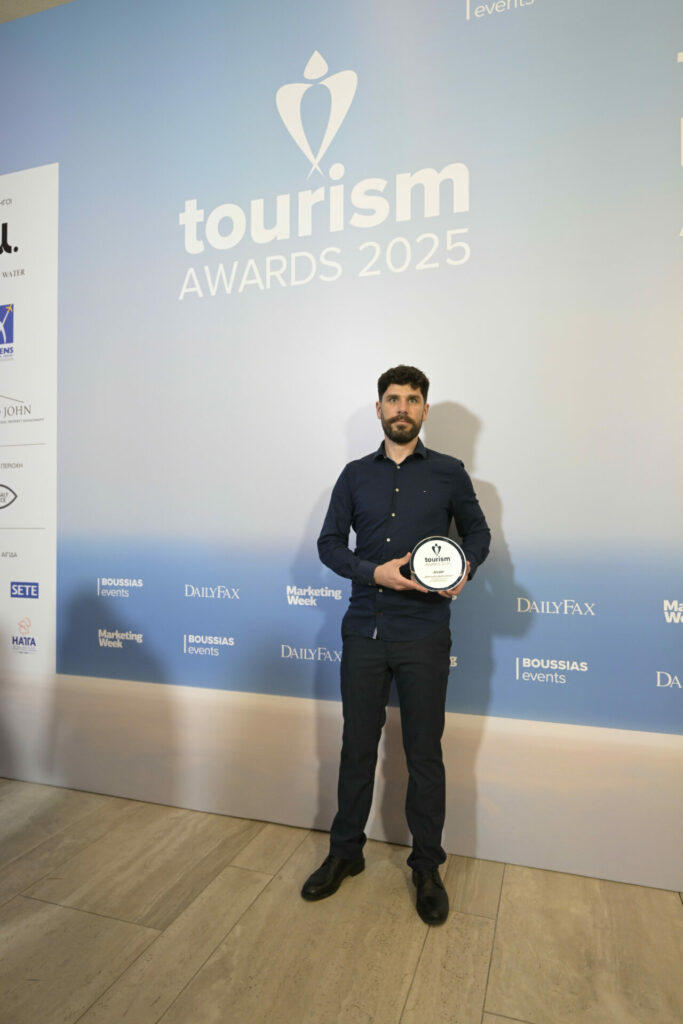 man holding award