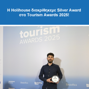 man holding award